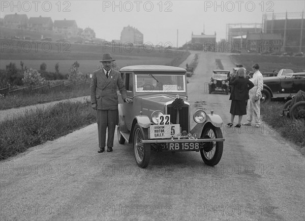 Wolseley Hornet saloon of DEM Douglas-Morris at the B&HMC Brighton Motor Rally, 1930. Artist: Bill Brunell.