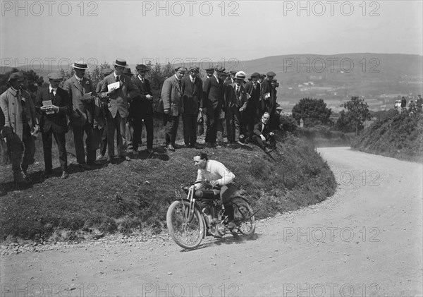 Motorcycle competing in the South Wales Auto Club Caerphilly Hillclimb, Wales, pre 1915.   Artist: Bill Brunell.