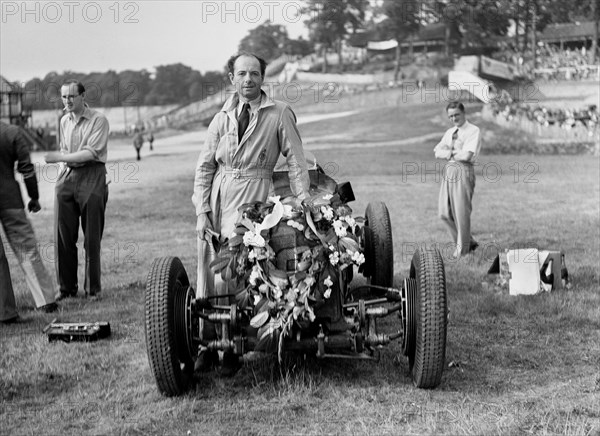 Raymond Mays with his ERA at Brooklands, Surrey, 1936. Artist: Bill Brunell.