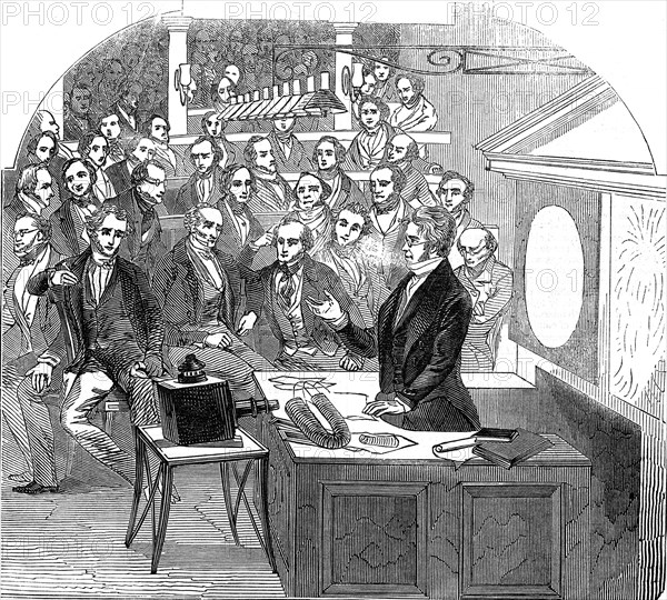 Michael Faraday lecturing on electricity and magnetism, Royal Institution, London, 1846. Artist: Unknown