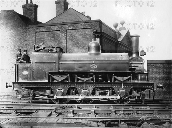 North Staffordshire 0-6-0 steam locomotive with driver and fireman on the footplate, 19th century. Artist: Unknown