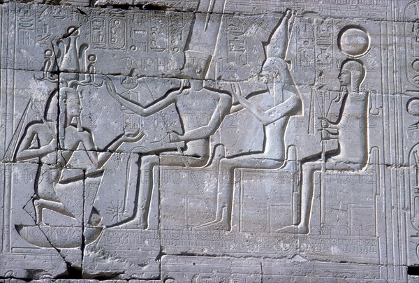 Relief of Rameses II kneeling before Amun Mut & Khons, The Ramesseum, Luxor, Egypt, c1250 BC. Artist: Unknown