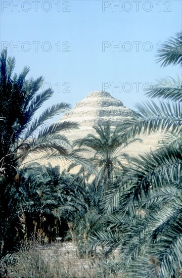 Step Pyramid (behind palms) of King Djoser, Saqqara, Egypt, 3rd Dynasty, c2600 BC. Artist: Imhotep