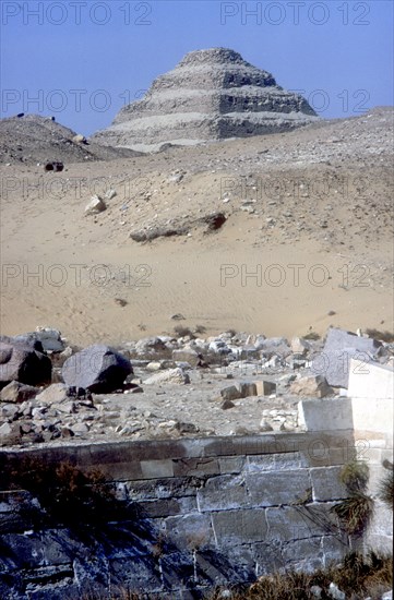 Step Pyramid of King Djoser (Zozer) behind ruins of temple, Saqqara, Egypt, c2600 BC. Artist: Imhotep