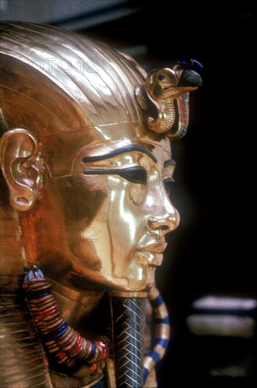 Gold mask of Tutankhamun on the second coffin. Artist: Unknown