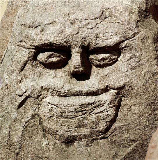 Stone head from pagan Celtic shrine at Cinderford, Gloucestershire. Artist: Unknown