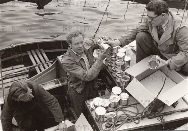 Loading yacht Forerunner with Rowntree Cocoa for a round-the-world voyage, 1954. Artist: Unknown