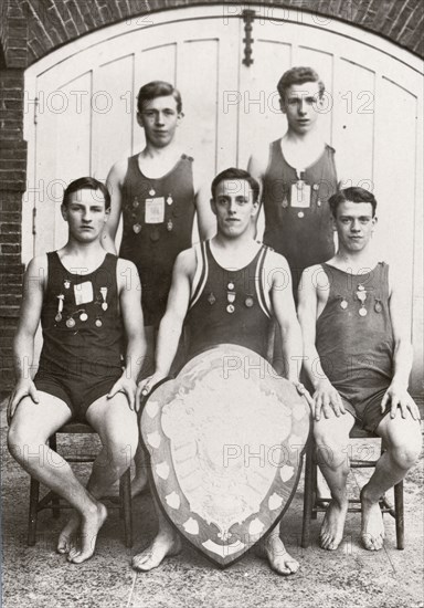 Rowntree boys life-saving team pose with the Faber Life-Saving Trophy, 1912. Artist: Unknown