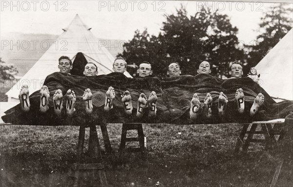 Rowntree boys at camp lie on a trestle,Coniston, Cumbria,  summer 1913. Artist: Unknown