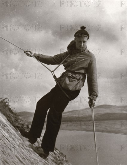 Boy descending rock face, Outward Bound School, Eskdale, Cumbria,1950. Artist: Unknown