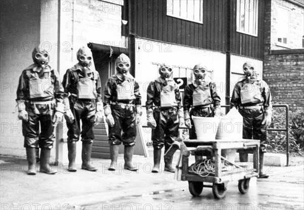 The Duncan?s factory decontamination unit dressed in their suits, Edinburgh, Scotland,1941. Artist: Unknown