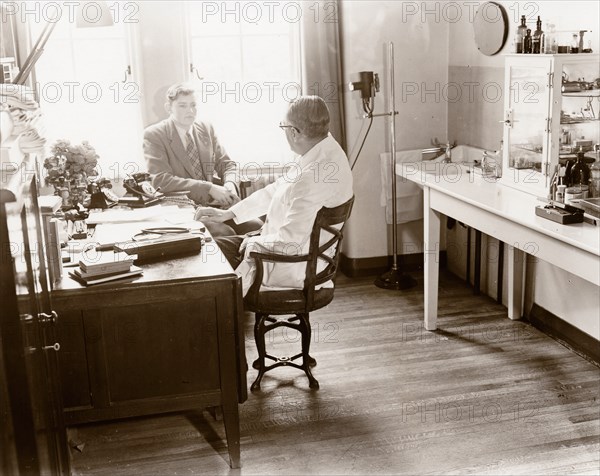 A man consults a Rowntree doctor in his surgery, York, Yorkshire, 1955. Artist: Unknown