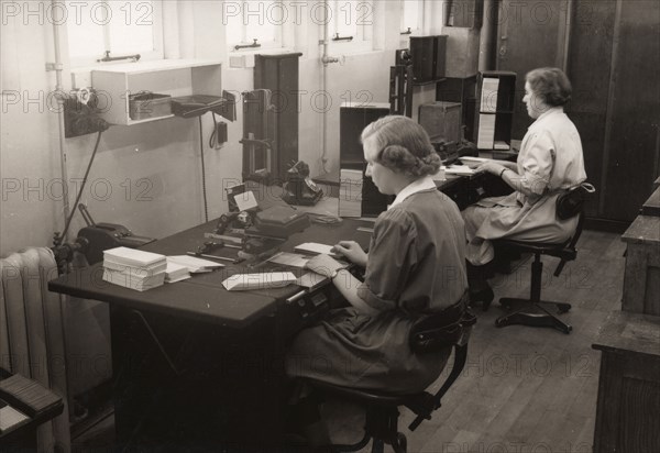 Two women at work in the wages office, Rowntree factory, York, Yorkshire, 1952. Artist: Unknown