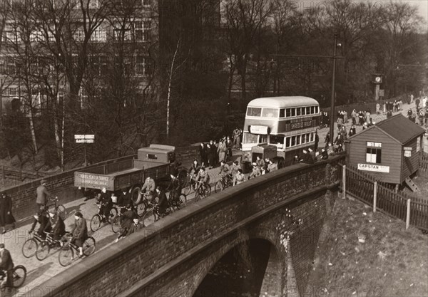 Staff leaving work at lunchtime, Rowntree factory, York, Yorkshire, 3 March 1938. Artist: Unknown