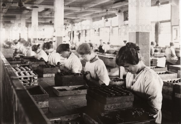 Piping whipped cream walnuts, Rowntree factory, York, Yorkshire, 1920. Artist: Unknown