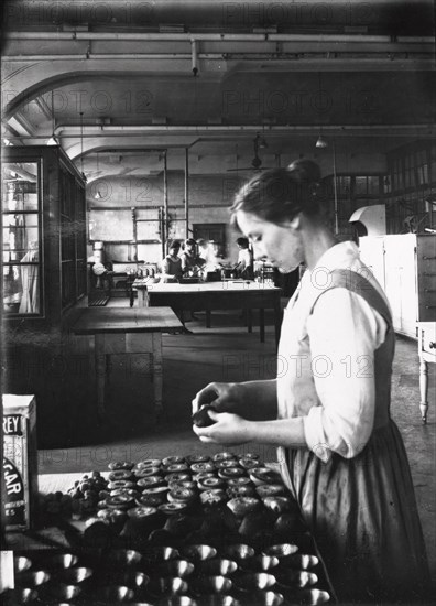 A cook makes pastry in the factory kitchens, Rowntree?s factory, York, Yorkshire, 1913. Artist: Unknown