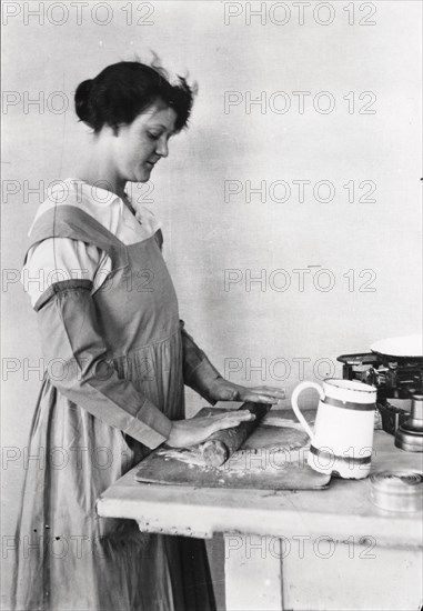 A woman rolls pastry, Rowntree?s factory, York, Yorkshire, 1920. Artist: Unknown