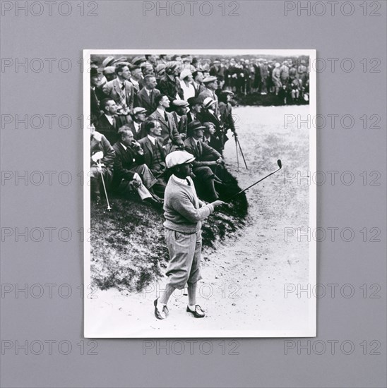 Bobby Jones playing a shot, c1920s. Artist: Unknown