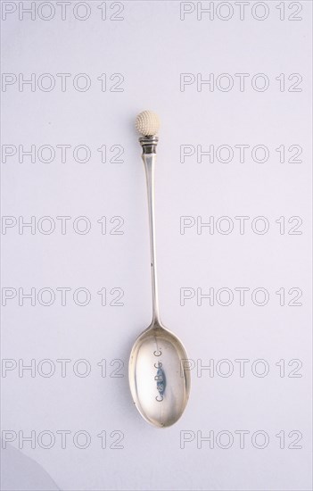 Silver spoon with golf ball motif, c1910. Artist: Unknown