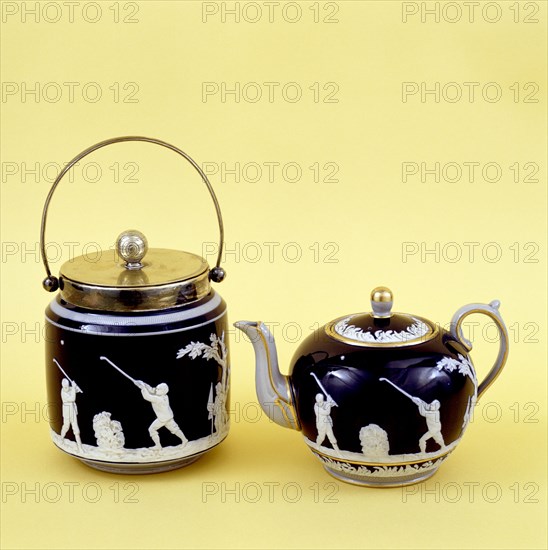 Copeland Spode biscuit barrel and teapot decorated with images of golfers, c1905. Artist: Copeland Spode