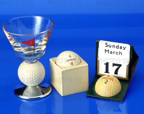 Hand-painted wine glass with golf ball,c1950; Advertising calendar with Penfold ball, c1930. Artist: Unknown