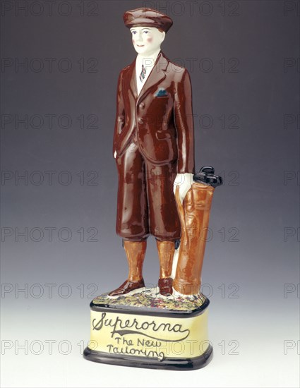 Pottery figure of a golfer advertising Superorna tailoring, 1920s. Artist: Unknown