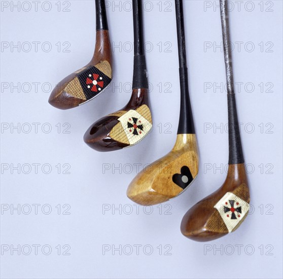 Spalding wooden clubs with coloured 'Fancy Face' inserts, American, 1920s. Artist: Spalding