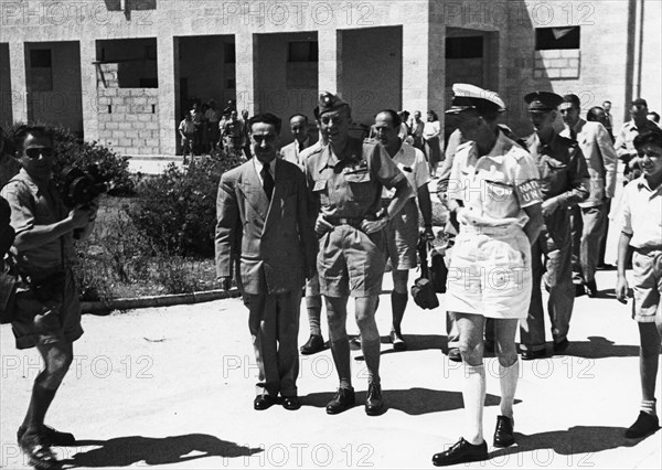 Count Folke Bernadotte (1895-1948) with UN men in the hall of the National Institutions. Artist: Unknown