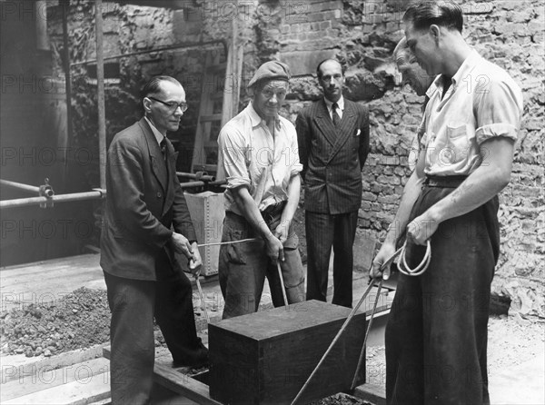 Burying a box containing copies of the Jewish Chronicle, London, 1955. Artist: Unknown