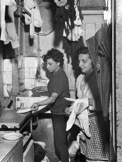 Slum dwelling in London's East End, 1965. Artist: EH Emanuel