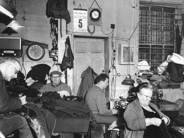 Tailor's workshop, Whitechapel, London, (c1960?) Artist: EH Emanuel