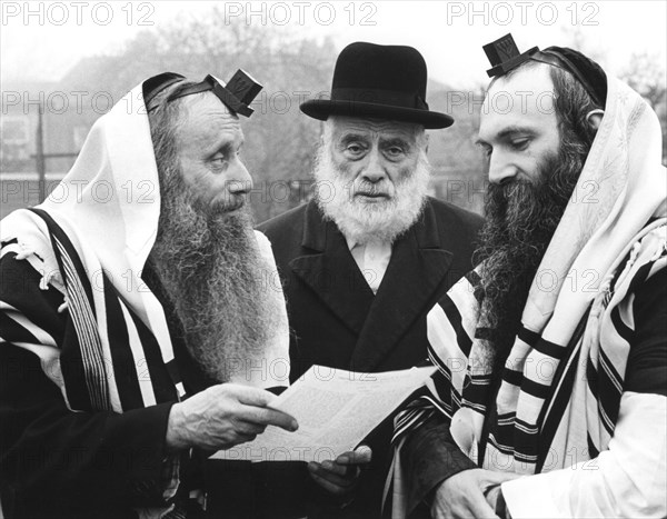 Hasidic Jews wearing tefillin and tzitzit, 1981. Artist: Sidney Harris