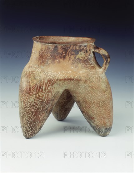 Tripod jar with strap handle and hollow legs, Qijia culture, Qinghai province, China, 1800-1500 BC. Artist: Unknown