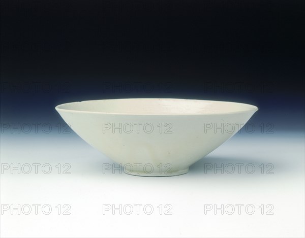 White ware bowl with moulded twin fish and floral pattern, Jin dynasty, China, 12th century. Artist: Unknown