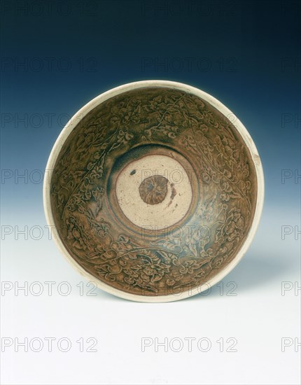 White rimmed celadon bowl with moulded peony scrolls, Jin dynasty, China, 13th century. Artist: Unknown