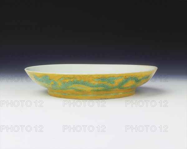 Yellow saucer with dragons in green enamel, Zhengde period, Ming dynasty, China, 1506-1521. Artist: Unknown