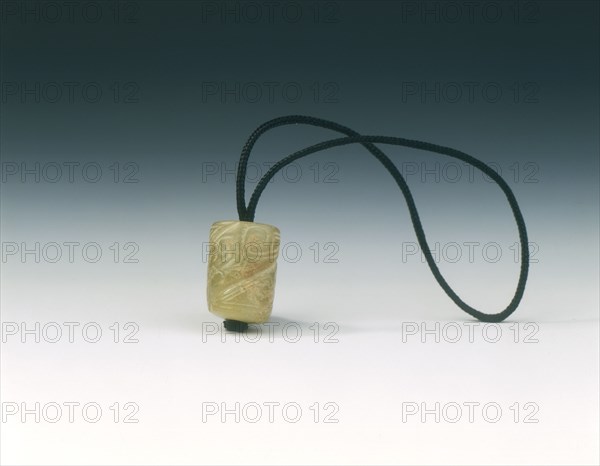 Jade bead with spiralling decoration, Western Zhou dynasty, China, c1100-771 BC. Artist: Unknown