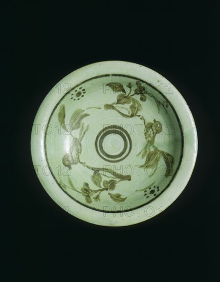 Celadon saucer with underglaze brown birds on branches, China, c1900. Artist: Unknown