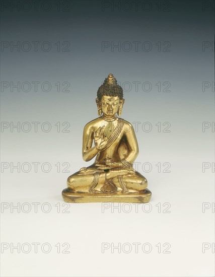 Gilt brass Amoghasiddhi, Buddha of infallible magic, Mongolia, 18th century. Artist: Unknown