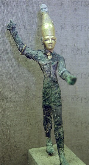 Gold and bronze statuette of Baal hurling a thunderbolt. Artist: Unknown