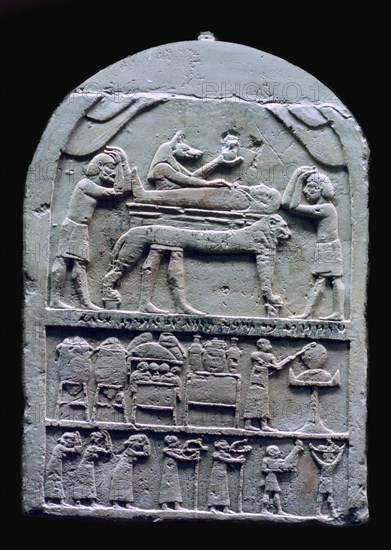 Egyptian stele showing Anubis preparing a mummy. Artist: Unknown