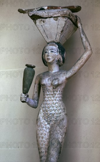 Egyptian statuette of a woman bearing offerings, 22nd century BC. Artist: Unknown