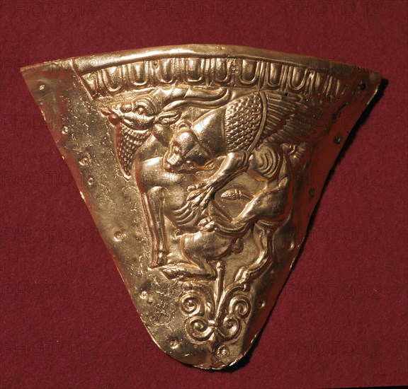 Scythian gold plate showing a winged panther attacking a goat. Artist: Unknown