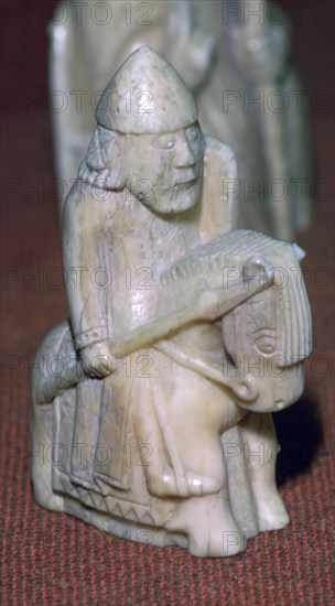 A Knight - The Lewis Chessmen, (Norwegian?), c1150-c1200. Artist: Unknown