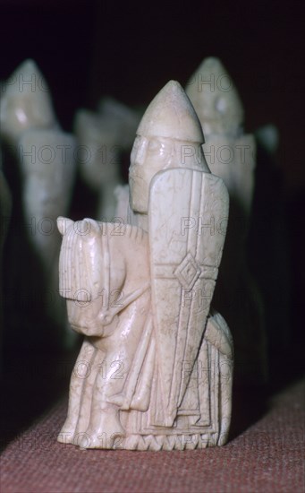 A Knight - The Lewis Chessmen, (Norwegian?), c1150-c1200. Artist: Unknown