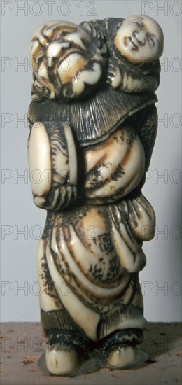 Japanese Netsuke of a Chinese dancer and child, 18th century.  Artist: Masahira