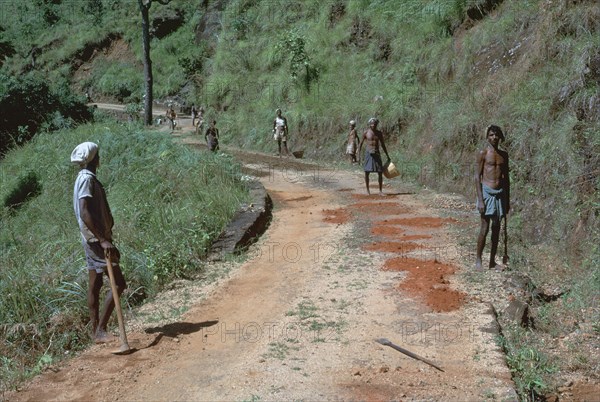 Primitive road-repairs in Sri Lanka. Artist: CM Dixon Artist: Unknown