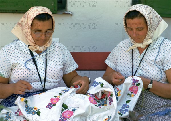 Two Hungarian women embroidering. Artist: CM Dixon Artist: Unknown