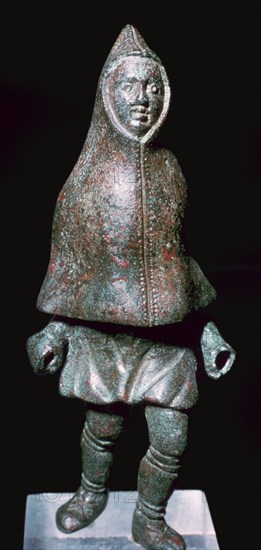 Roman bronze figure of a man wearing a cloak, 4th century. Artist: Unknown