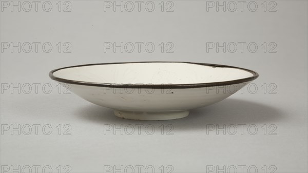 Small Ding-type bowl with incised peony scroll and dragon, 20th century. Artist: Unknown.